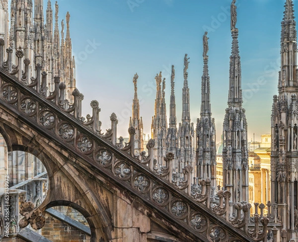 Fototapeta Flying buttress and rows of pinnacle sculptures on the rooftop aisle of Milan Cathedral