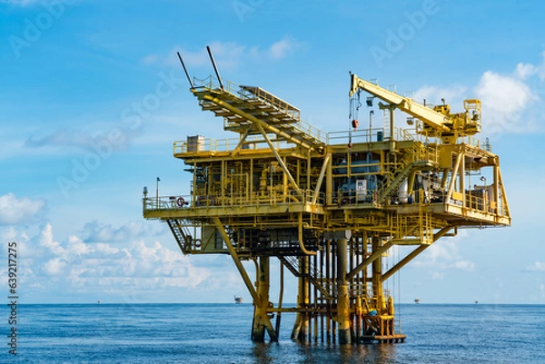 Fototapeta Offshore oil and gas wellhead remote platform which produced raw material for sent to onshore refinery, power generation and petrochemical industry.