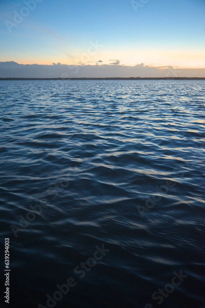 Fototapeta Los Flamencos National Reserve, Colombia - January 2 2023: Sunset sea close-up view romantic beautiful background