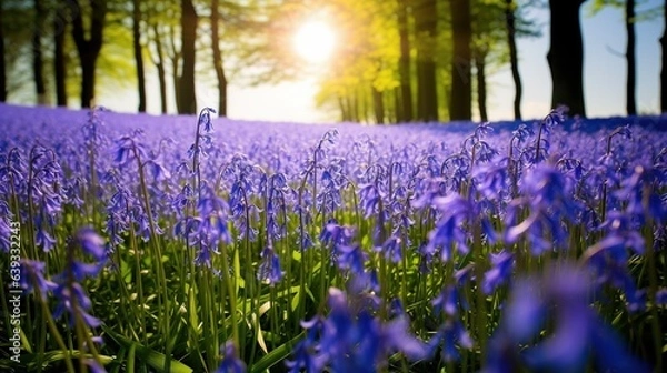 Fototapeta  a field full of purple flowers next to a forest of trees.  generative ai