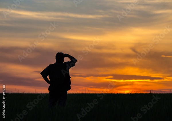 Obraz silhouette of man standing in a field