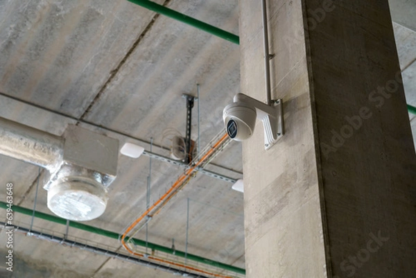 Fototapeta The digital security camera inside the warehouse