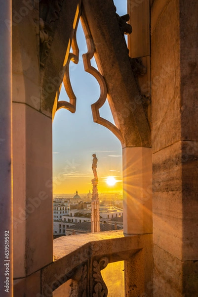 Fototapeta Window view from Milan Cathedral looking at the sunset