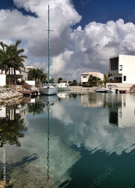 Fototapeta sailing boats reflected in water canal