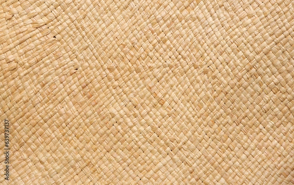 Fototapeta Brown wicker woven bag or straw bag. Woven natural straw texture as background. Wicker woven texture 