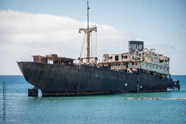 Fototapeta Ship stranded on the coast of Arrecife in Lanzarote, called Telamón. Rusty boat. Stranded ship. Broken ship. Lanzarote, Canary Islands, Spain