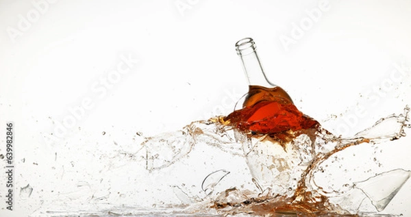 Fototapeta Bottle of Pink Wine Breaking and Splashing against White Background