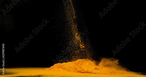 Obraz Turmeric, curcuma longa, Powder falling against Black Background, Indian Spice