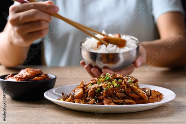 Fototapeta Korean stir fried kimchi cabbage with pork eating with kimchi and cooked rice