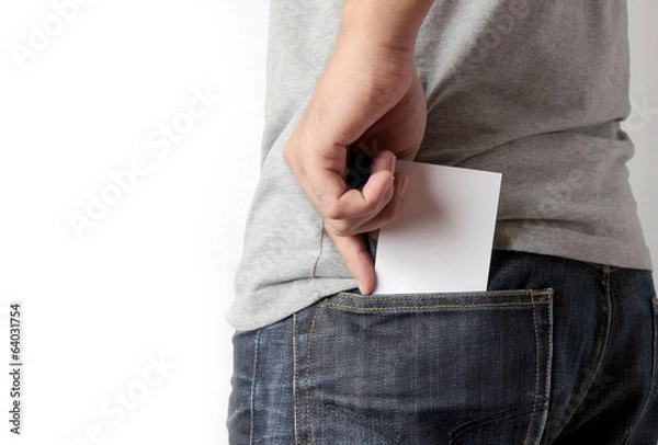 Obraz Closeup man pulling a card on his back pocket