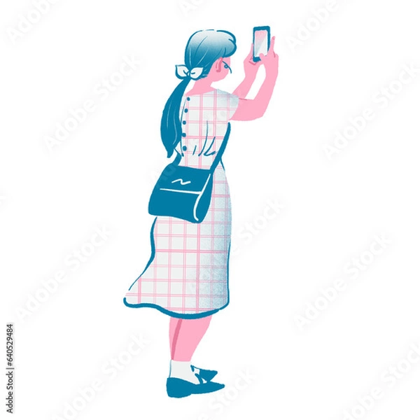 Obraz スマートフォンで写真を撮る若い女性