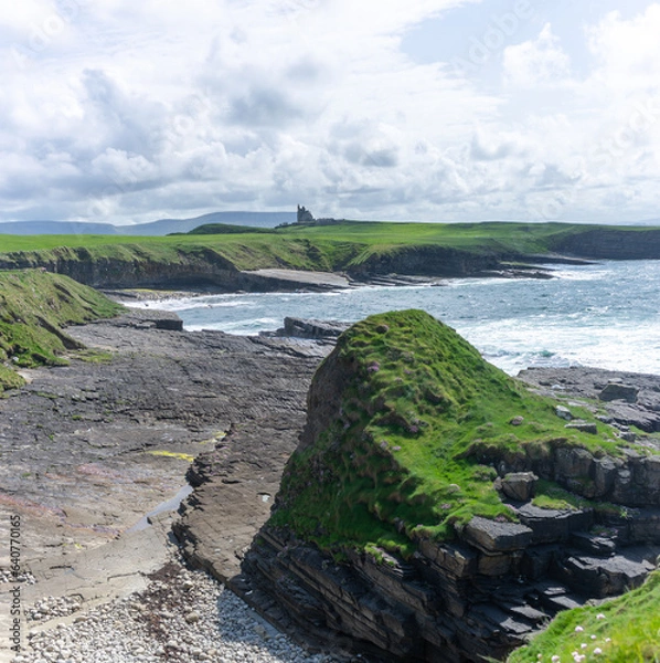 Fototapeta irish seaside with castle in the distance