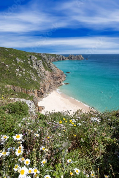 Fototapeta Beautiful calm day from the south west coast path in Cornwall at Portcurno looking towards Logan Rock from Carn Kizzie.