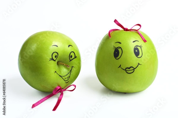 Fototapeta apples with comically painted faces on a white background