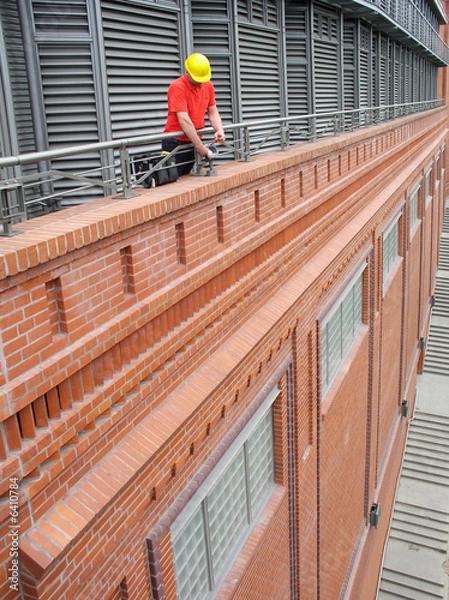 Obraz electrician fixing a bulb-holder