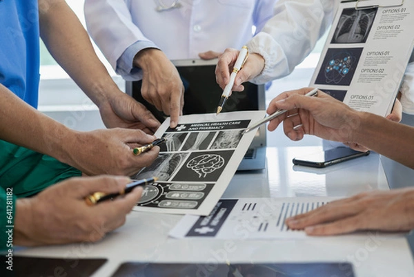 Fototapeta Meeting with doctors in white lab robes and surgical scrubs, sitting at tables, discussing medical patient records, working on diversity shows, collaboration, teamwork or workshops for data analysis.