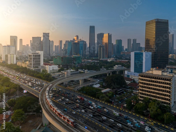 Fototapeta First time Light Trail Transit Train (LRT) operate in Jakarta, Indonesia. The LRT is going through the longest long span structure in the world. 