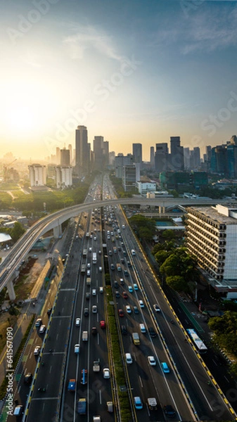 Fototapeta First time Light Trail Transit Train (LRT) operate in Jakarta, Indonesia. The LRT is going through the longest long span structure in the world.
