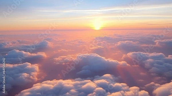 Fototapeta Beautiful sunset sky above clouds with dramatic light. Cabin view from airplane