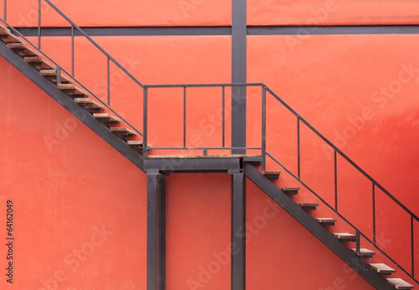Obraz red wall and red staircase