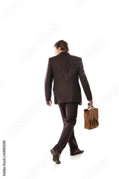 Fototapeta back view of walking business man
