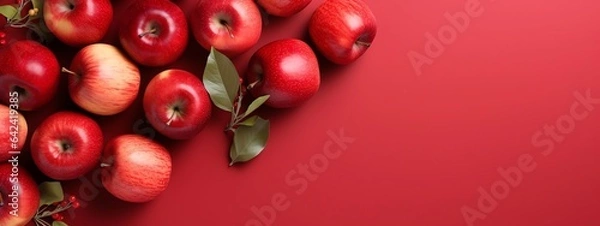 Obraz Red apples with leaves on red background
