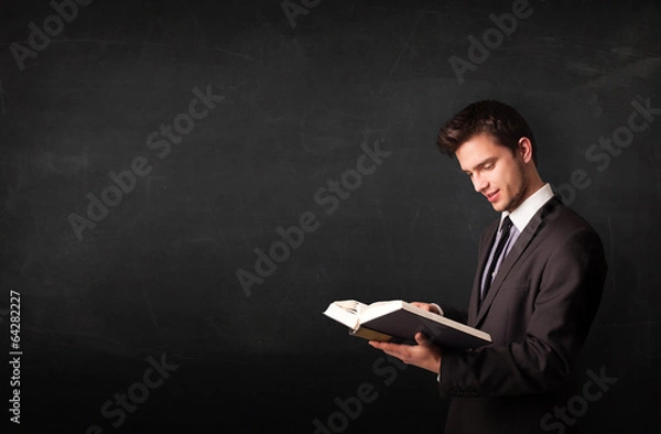 Obraz Young man reading a book