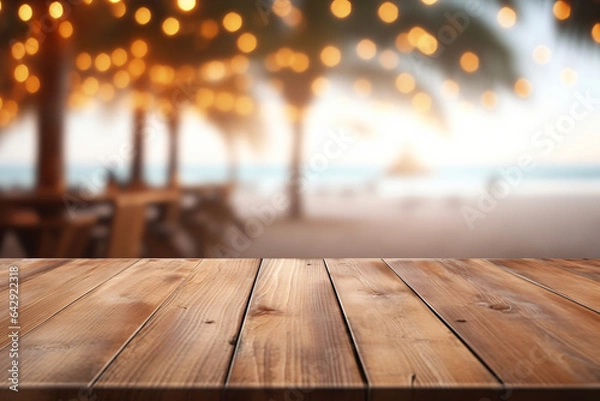 Fototapeta Drewniany stół i Blur Beach Cafes Tło ze światłami bokeh. Wysokiej jakości zdjęcie