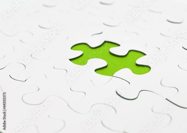 Fototapeta Missing puzzel in green color. Selective focus