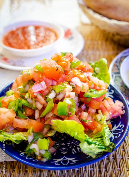 Fototapeta Closeup of colourful Moroccan vegetable salad placed on the dining table in a restaurant in Marrakech