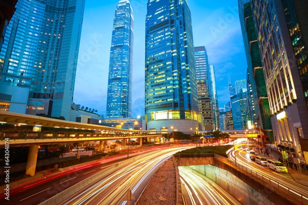 Obraz Road tunnels light trails on modern city buildings backgrounds i