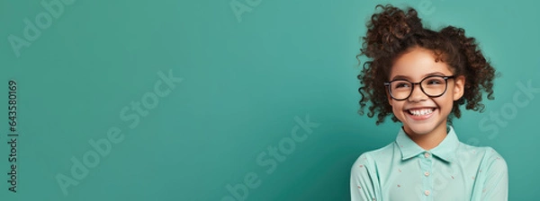Fototapeta Photo of smiling middle school student with glasses on solid background. Online education concept. Copy-space, Course banner