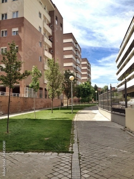 Obraz buildings, grass and sidewalk