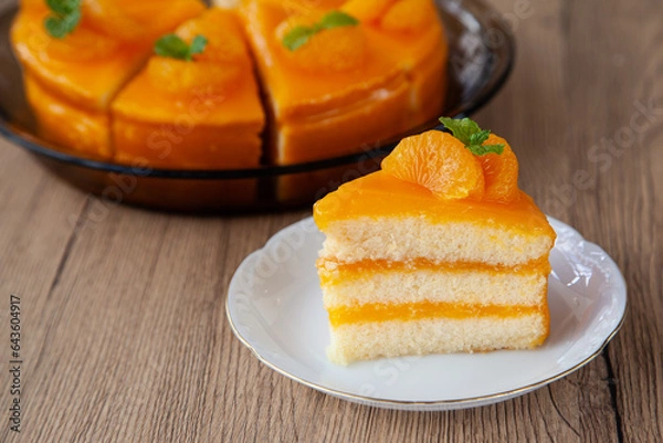 Fototapeta Refreshing orange sponge layer cake