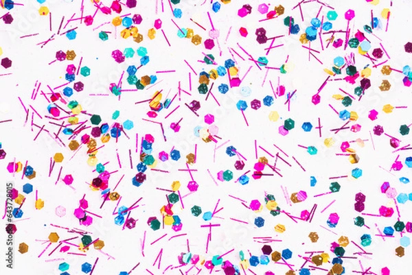 Fototapeta Colorful glitter sparkle confetti background liquid drops of paint color flow down on white canvas. Dark multicolored glitter paint dripping on the white wall