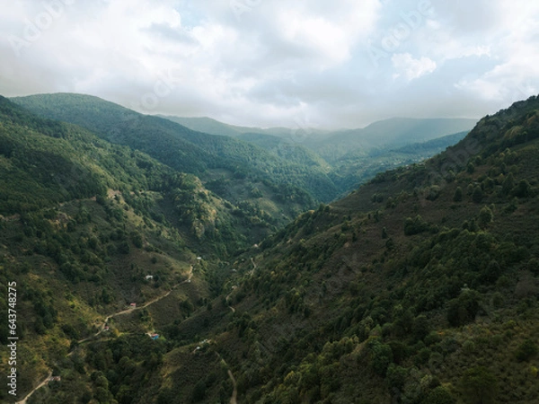 Fototapeta amazing drone view of hills in cloudy day