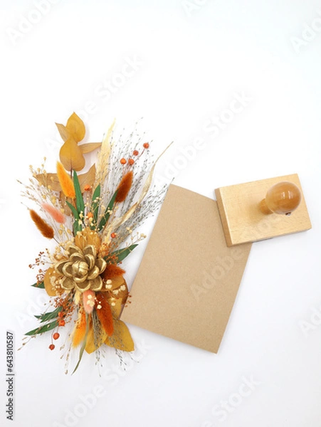 Fototapeta Flatley of yellow flowers on white background , beige envelope and seal, top view, space for text. Decor, welcome card. High quality photo
