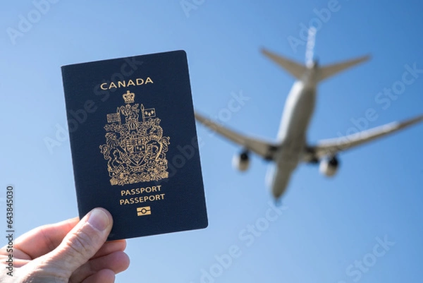 Fototapeta Canadian Passport with Airplane in the Background
