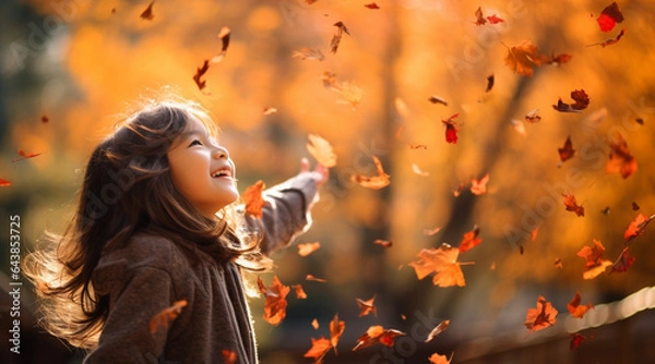 Obraz 落ちてくる紅葉を浴びながら楽しそうに笑い見上げる子どもたちの幸せそうな様子
