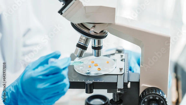 Fototapeta Close up scientist conducting precise virus lab test, scientific methodology, microbiologist conducting virus detection and testing in progress