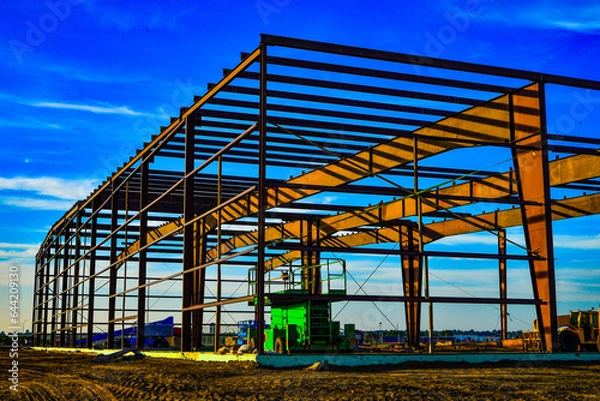 Obraz Rigid steel framing members are creating a solid framework for this new commercial building under construction.