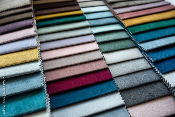 Fototapeta Catalog of new upholstery fabric samples on home sofa or renovation other