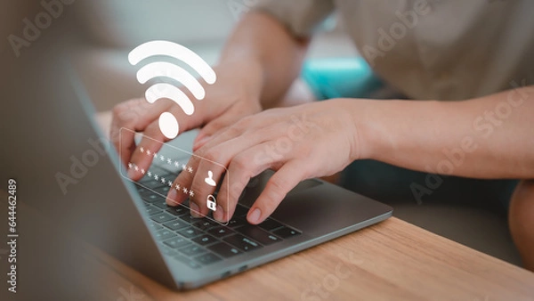 Obraz User use a computer laptop to connect to wifi in hotel, but wifi password is incorrect. Working and waiting to loading digital data form website, concept technology of waiting for connect to Wi-Fi.