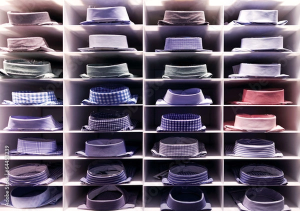 Obraz Folded colourful shirts on clothes rack