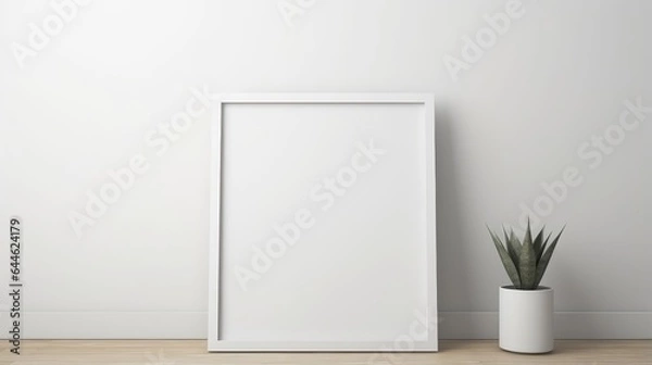 Fototapeta Picture frame on a white wall in a minimalist interior