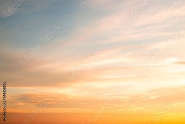 Fototapeta Beautiful , luxury soft gradient orange gold clouds and sunlight on the blue sky perfect for the background, take in everning,Twilight, Large size, high definition landscape photo