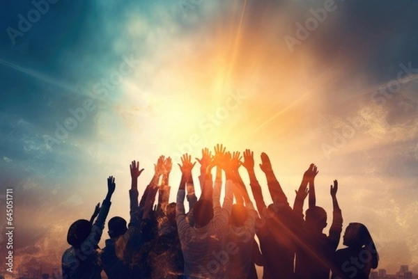 Fototapeta Hands to heaven, group of people with their hands up looking at the sunset