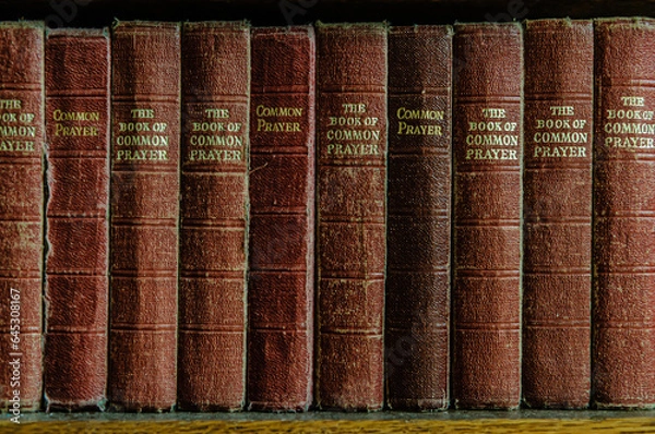 Fototapeta Row of the Book of Common Prayer on a shelf in a church