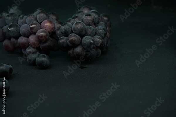 Fototapeta Bunch of grapes with black background , black text space