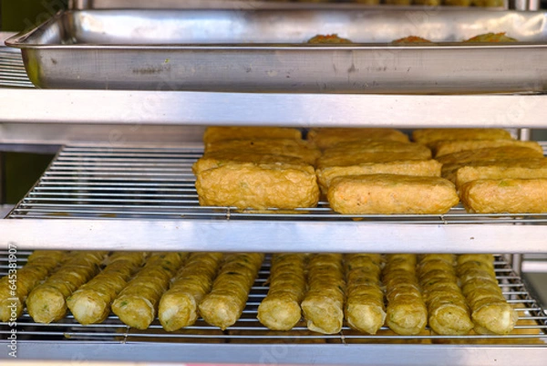 Fototapeta Hoi jo Crab Meat ball and Crispy prawn and tofu skin ball are being placed on a tray for sale.